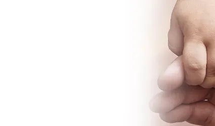 Toddler holding adult hand
